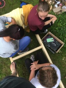 Young People building a bench