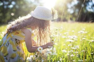 girl picking flowers